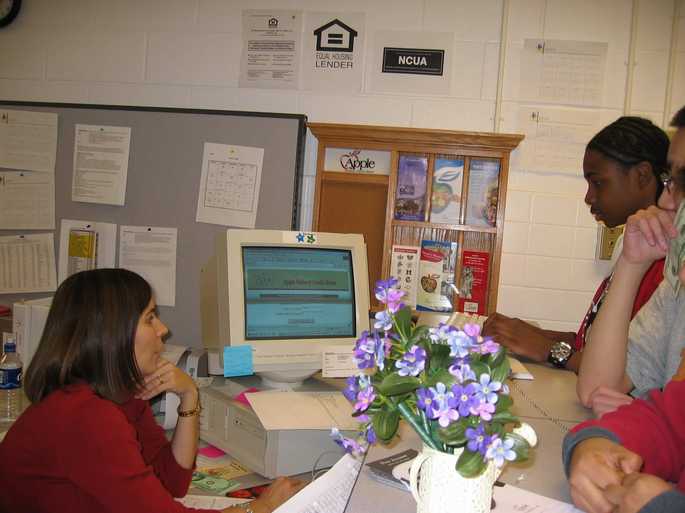 Apple FCU staff help students in the 1990s