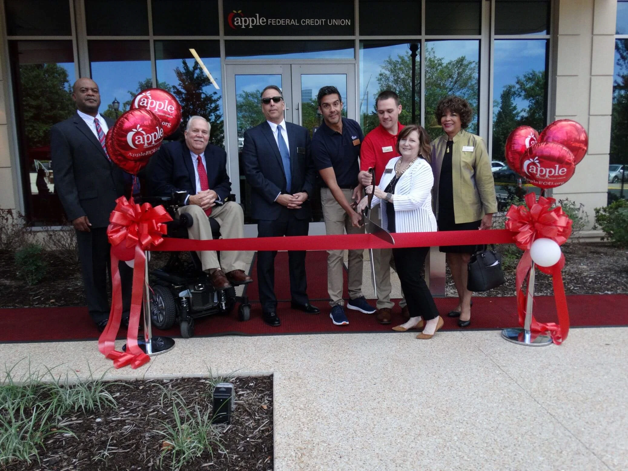 Apple FCU at a ribbon cutting ceremony in the 2010s