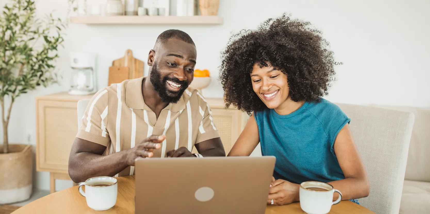 No-Spend September - Man and woman using a computer