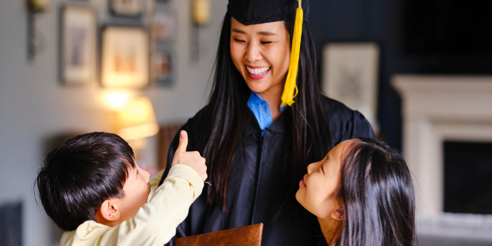 Image of: woman wearing cap and gown with children
