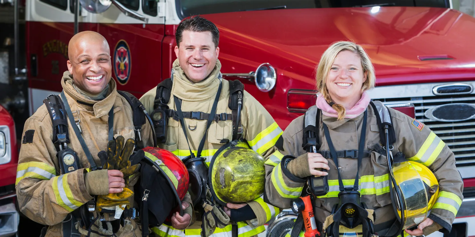 7 Things to Know About Educator and First Responder Loans - Firefighters standing beside truck