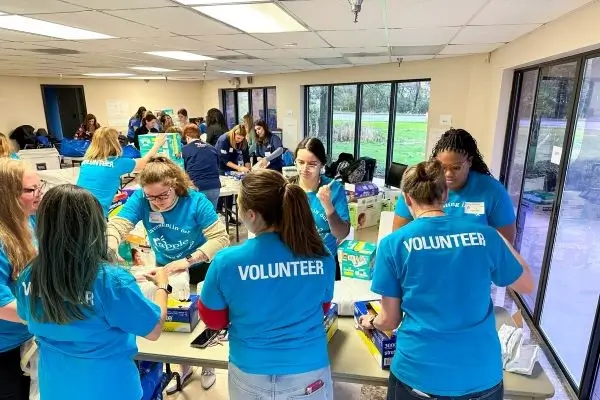Apple FCU Staff volunteering at a community event