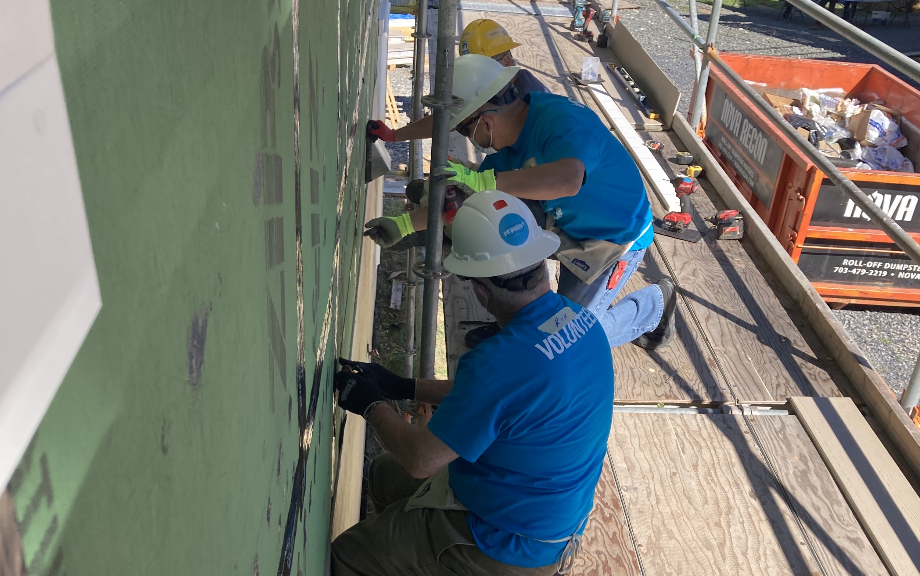 Volunteers working on a house